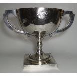 A hallmarked silver large pedestal trophy cup, 2 handles, with presentation inscription,