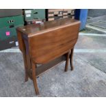 An early 20th century mahogany Sutherland table with drop leaves