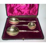 A set of silver gilt fruit spoons, pair of servers and a sifter spoon, cased, W Hutton, London 1898