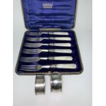 6 dessert forks with mother of pearl handles and 2 silver napkin rings