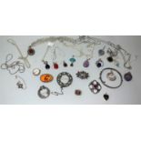 A selection of silver and white metal pendants; other jewellery