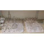 A good selection of cut drinking glasses; a Kosta decanter; a cut decanter; various custard cups