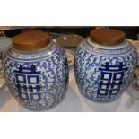 A large pair of Chinese blue and white ginger jars with wooden lids, height 26 cm