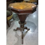 A Victorian trumpet shaped workbox in inlaid walnut with chessboard top, on tripod base