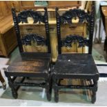 A pair of 19th century dark oak Derbyshire style country chairs