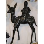 An oriental bronze depicting a sage riding on a deer (some damage, missing pieces, sage detachable)
