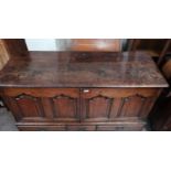 An 18th century country made oak mule chest with twin arched and fielded panelled doors over 5