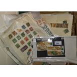 A collection of Chinese stamps in packets and on album leaves