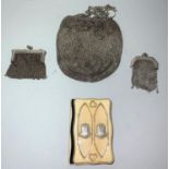 A white metal drawstring purse, stamped 'sterling', 5 oz; 2 similar miniature mesh purses