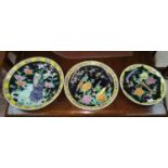 A group of 3 oriental porcelain saucer dishes of graduating sizes, each with mythical bird on