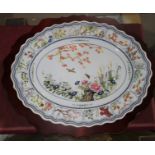 A Franklin Mint Chinese porcelain oval dish, 40 cm, on stained wood table base