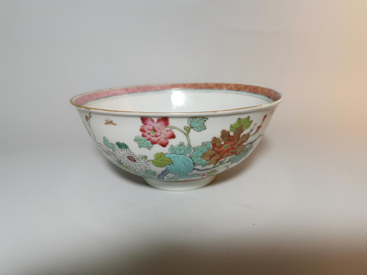 A late 19th/early 20th century Chinese porcelain bowl decorated with exotic birds and plants in