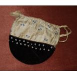 A 19th century beaded and embroidered silk purse with drawstring