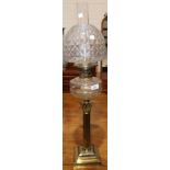 A Victorian brass oil lamp with Corinthian column, glass reservoir and shade