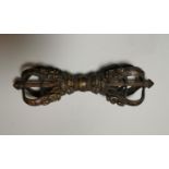 A Tibetan cast and gilded bronze ritual sceptre decorated with figures in relief, length 23 cm