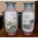 A 20th century Chinese pair of large cylindrical vases decorated in the Cantonese manner with