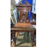 A Victorian carved walnut hall chair