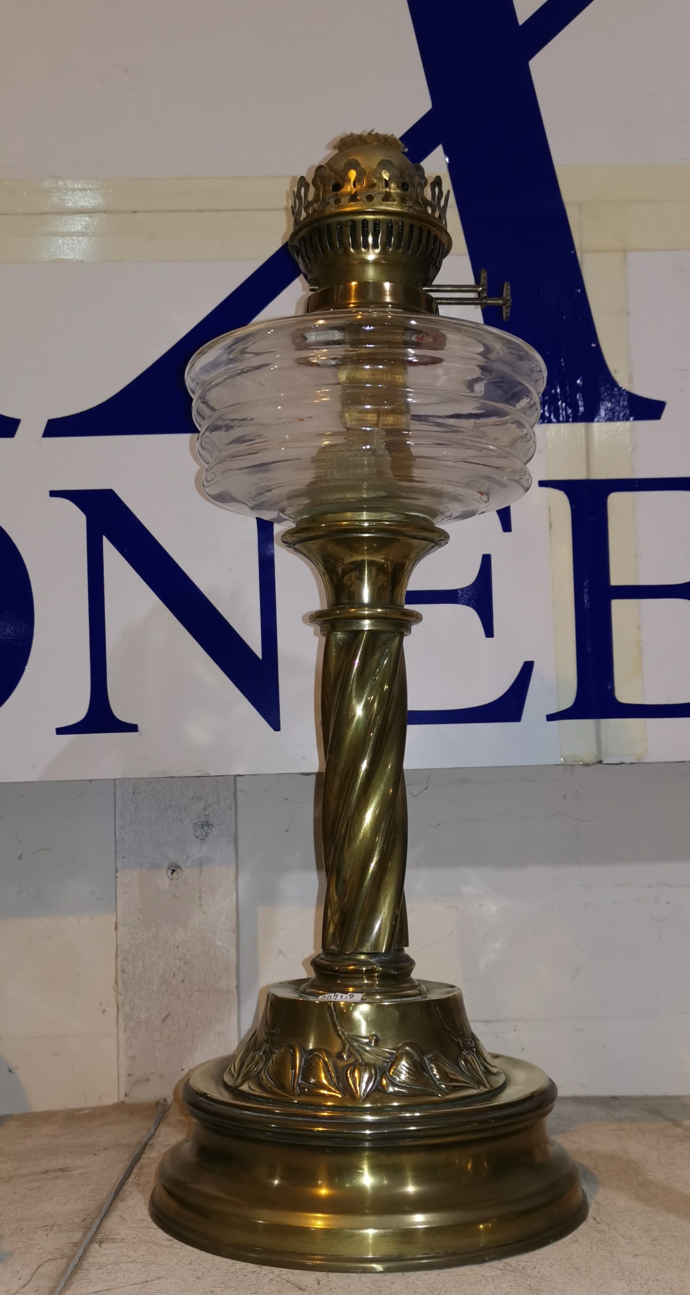 A Victorian brass oil lamp with glass reservoir