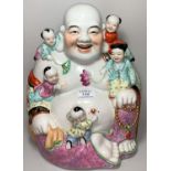 A 20th century Chinese Canton large figure of Hoti with children, in the famille rose palette,