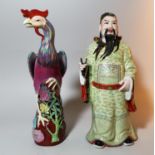 A Chinese porcelain figure of an Immortal, 20th century, 31 cm; a similar figure of a mythical bird
