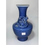 A Chinese blue glaze baluster vase with entwined relief dragon to neck, printed seal mark to base,