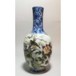 A Chinese porcelain vase of ovoid form with slender neck, 20th century, decorated with birds in a