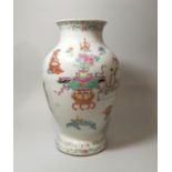 A 19th century Chinese inverted baluster porcelain vase decorated with antiquities in polychrome,