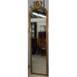 A Victorian full length pier mirror in arch top gilt frame with ornate crest, height 198 cm