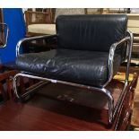 A mid century deep armchair, chromed steel frame with black leather covered seat and back cushions