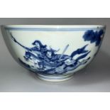 A Chinese Kangxi blue and white bowl decorated with galloping warriors to outside 2 figures with