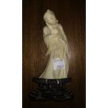 A Chinese ivory effect figure of a sage with stick and gourd vase, height 11 cm