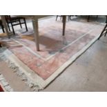 A large Chinese carpet, pink ground with floral decoration in the Aubusson style, 146" x 105"