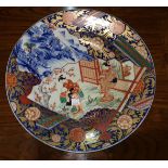 A late 19th/early 20th century Imari dish depicting dancing figures