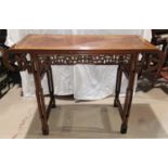 A late 19th/early 20th century Chinese hardwood altar table, with rounded ends and pierced frieze on