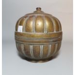 A Mughal Indian brass betel nut container of ribbed gourd form, 15 cm