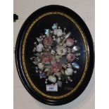 A Victorian unusual oval shell collage in the form of flowers; a similar collage; an oval lacquer
