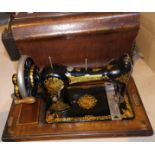 A Jones hand operated sewing machine with cover