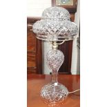 An early 20th century cut glass table lamp with mushroom shade