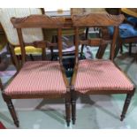 A set of 6 William IV mahogany dining chairs, with scroll top rails and drop in seats, on turned