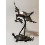 A Chinese bronze figure group of a crane on a dragon turtle, 24 cm