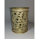 A Chinese pierced cylindrical brass brush pot, bitong, decorated with cranes in stylised clouds,