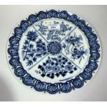 A 19th century Chinese porcelain blue & white plate, the quartered central panel decorated with