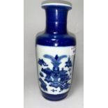A Chinese Kangxi rouleau shaped blue and white vase, the reserve panels decorated with a landscape