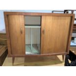 A 1960's record cabinet with tambour front, 31"; a collection of records