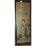 A large water colour on silk depicting an aristocratic woman and girl by a flowering cherry tree,