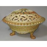 A Royal Worcester covered bowl in peach blush basket weave, with reticulated lid and 4 paw feet,