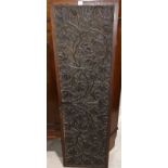 A late 19th/early 20th century Indian hardwood panel with all over carved decoration of fruiting