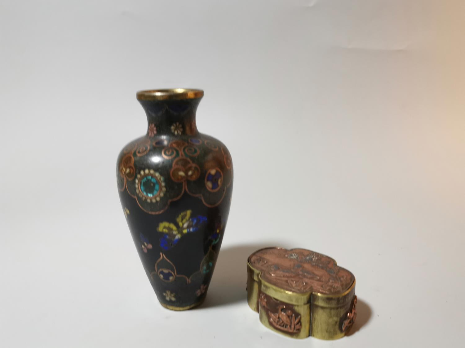 A Japanese cloisonné vase decorated with butterflies on blue ground, 12.5 cm; a brass and copper