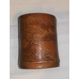 A Chinese bamboo brush pot with light relief carving of a landscape, height 11 cm