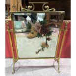 An Art Nouveau painted mirror firescreen in brass frame